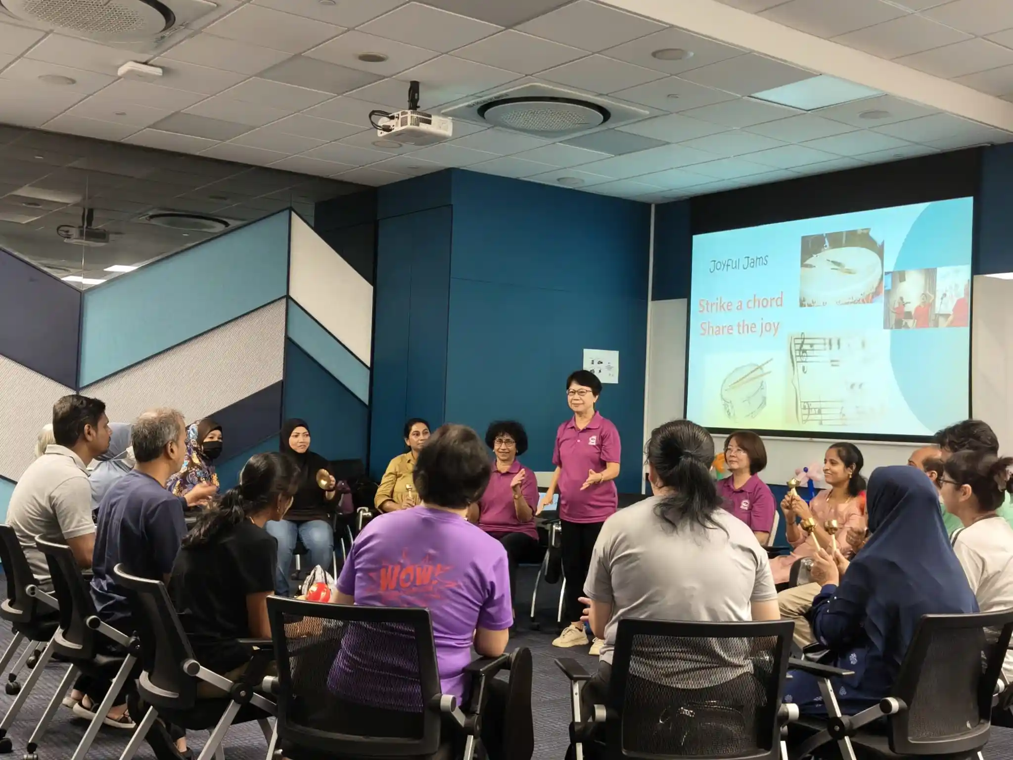 Caregivers participating in Laughter Yoga session at Nee Soon Central CC