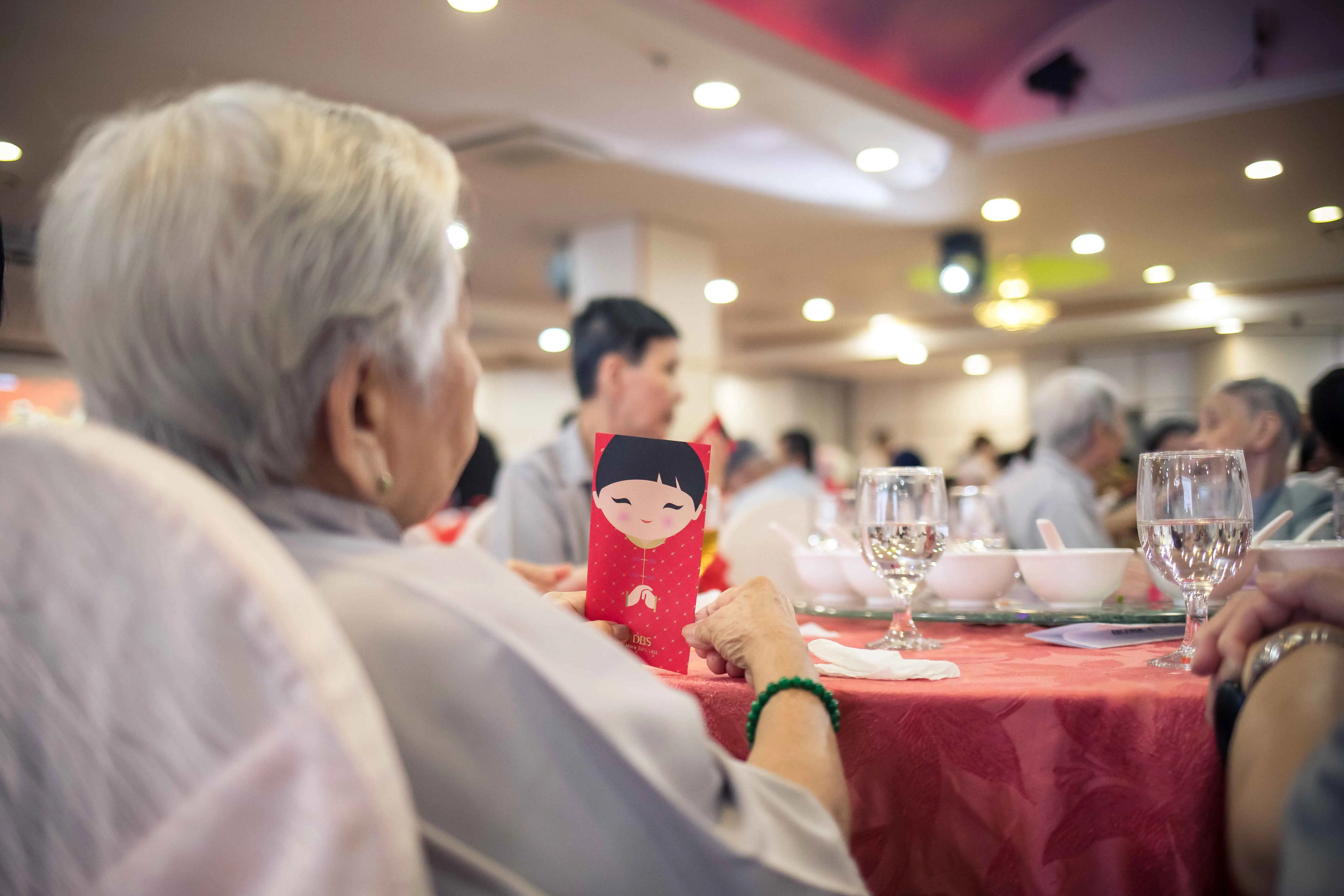 Lunar New Year Lunch celebration with seniors enjoying festive meal